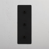 Corston-Kipphebelschalter 3x in vertikalem Dreifachrahmen – Bronze