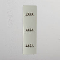 Corston-Kipphebelschalter 6x in vertikalem Dreifachrahmen – Poliertes Nickel