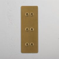 Corston-Kipphebelschalter 6x in vertikalem Dreifachrahmen – Antikes Messing