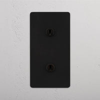 Corston-Kipphebelschalter 2x in vertikalem Zweifachrahmen – Bronze