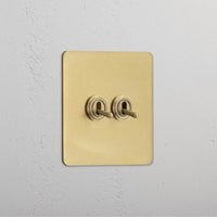 Corston-Kipphebelschalter 2x in Einfachrahmen – Antikes Messing