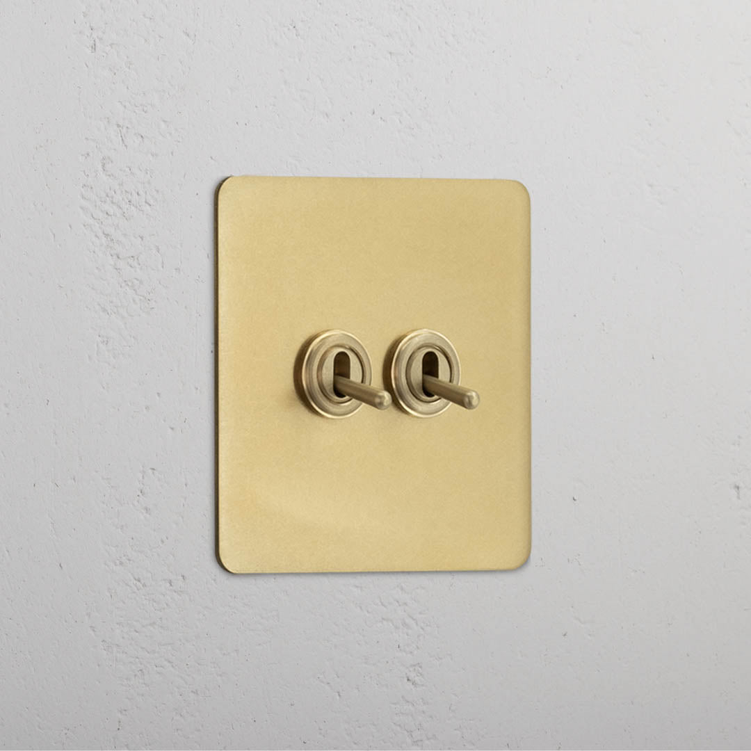 Corston-Kipphebelschalter 2x in Einfachrahmen – Antikes Messing