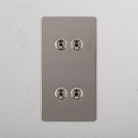 Corston-Kipphebelschalter 4x in vertikalem Zweifachrahmen – Poliertes Nickel