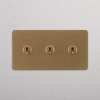 Corston-Kipphebelschalter 3x in Zweifachrahmen – Antikes Messing