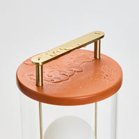 Muse – Tragbare Designerlampe in Claycourt Orange mit Dim-to-Warm & IP44
