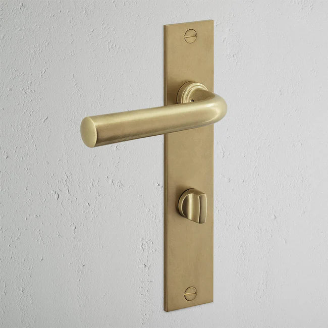 Corston Apsley Langschildgarnitur mit gefedertem Türgriff und Drehknopf – Antikes Messing