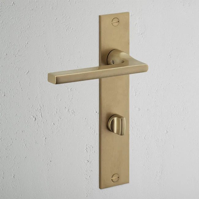 Corston Clayton Langschildgarnitur mit gefedertem Türgriff und Drehknopf – Antikes Messing