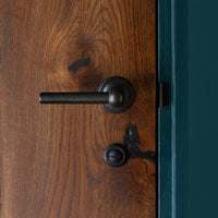 Corston Harper gefederter Türgriff – Bronze